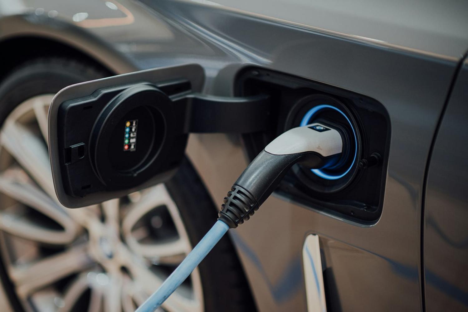 Electricity charging cable plugged into an electric vehicle
