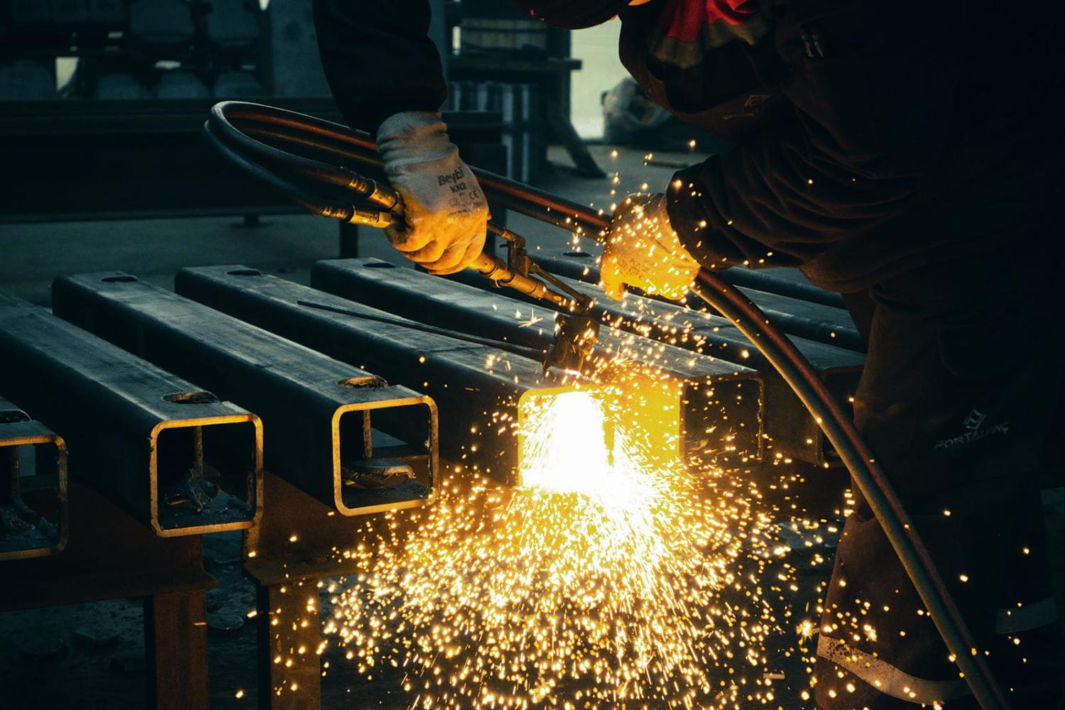 Close up view of a person welding metal