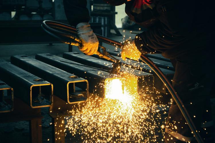 Close up view of a person welding metal